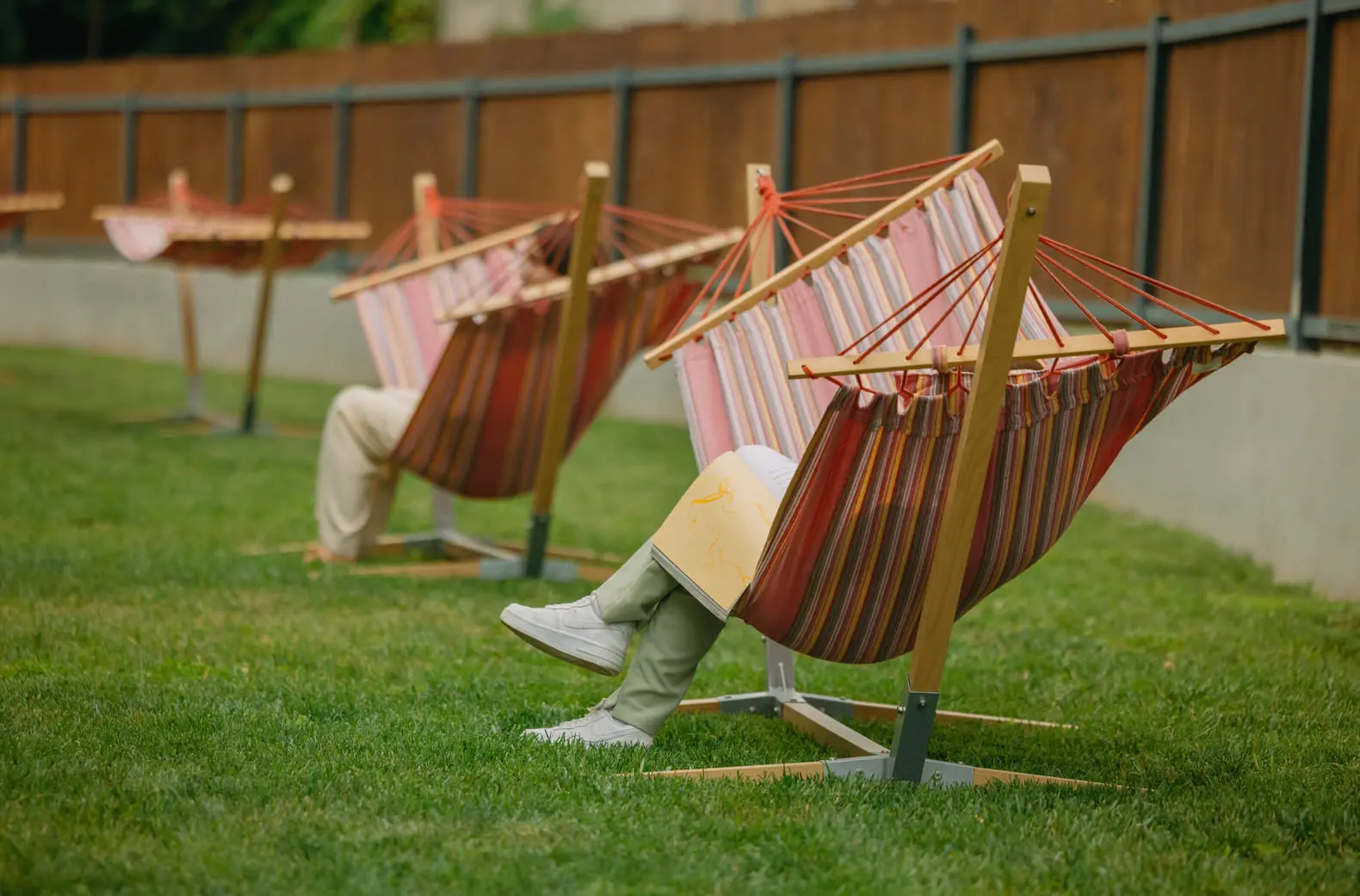 Striped hammocks on the lawn of the garden