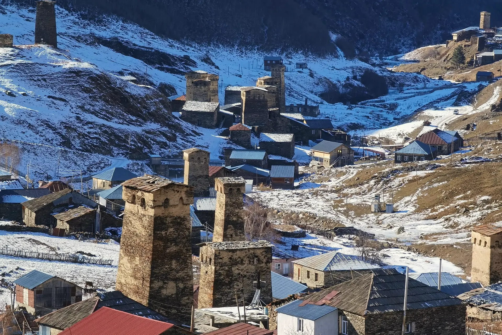 Svan towers in a snowy mountain valley in Upper Svaneti